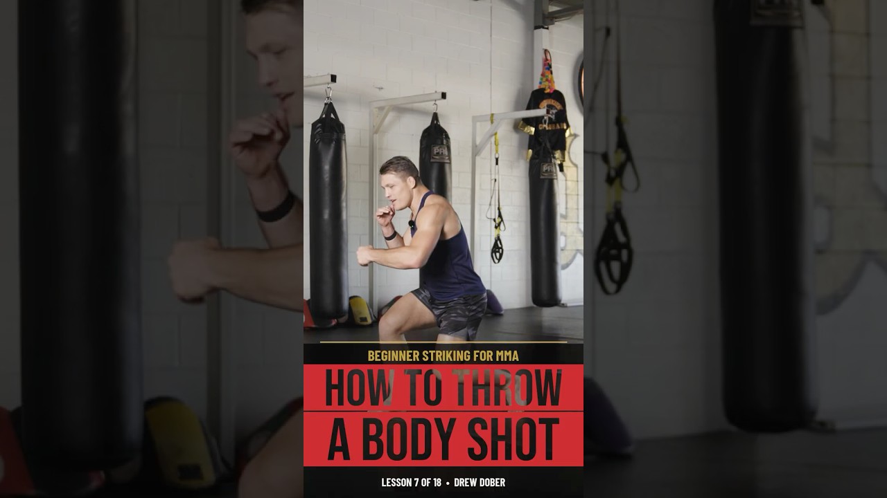 Drew Dober demonstrating body shot technique in the gym